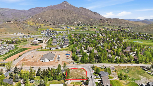 123 West 1050th North, Unit 41 Midway, UT 84049 - Photo 20 of 22 Vacant lot outlined in red, featuring direct road frontage and a mountain backdrop