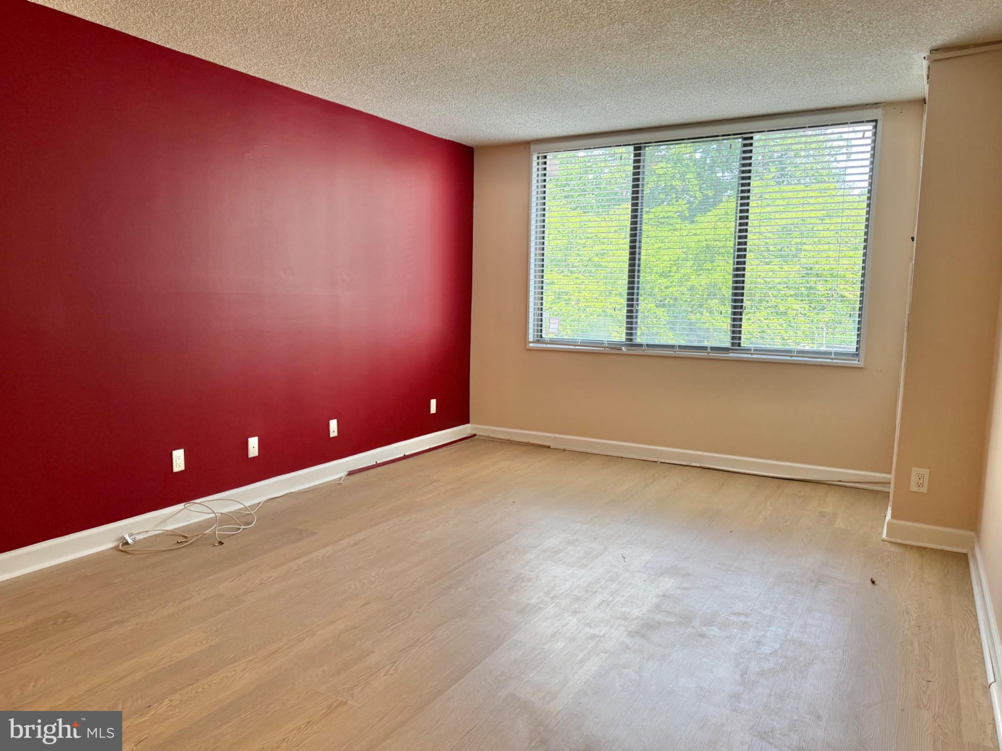 5225 Pooks Hill Road, Unit 303S Bethesda, MD 20814 - Photo 3 of 19 Bright space with bold red accent wall.