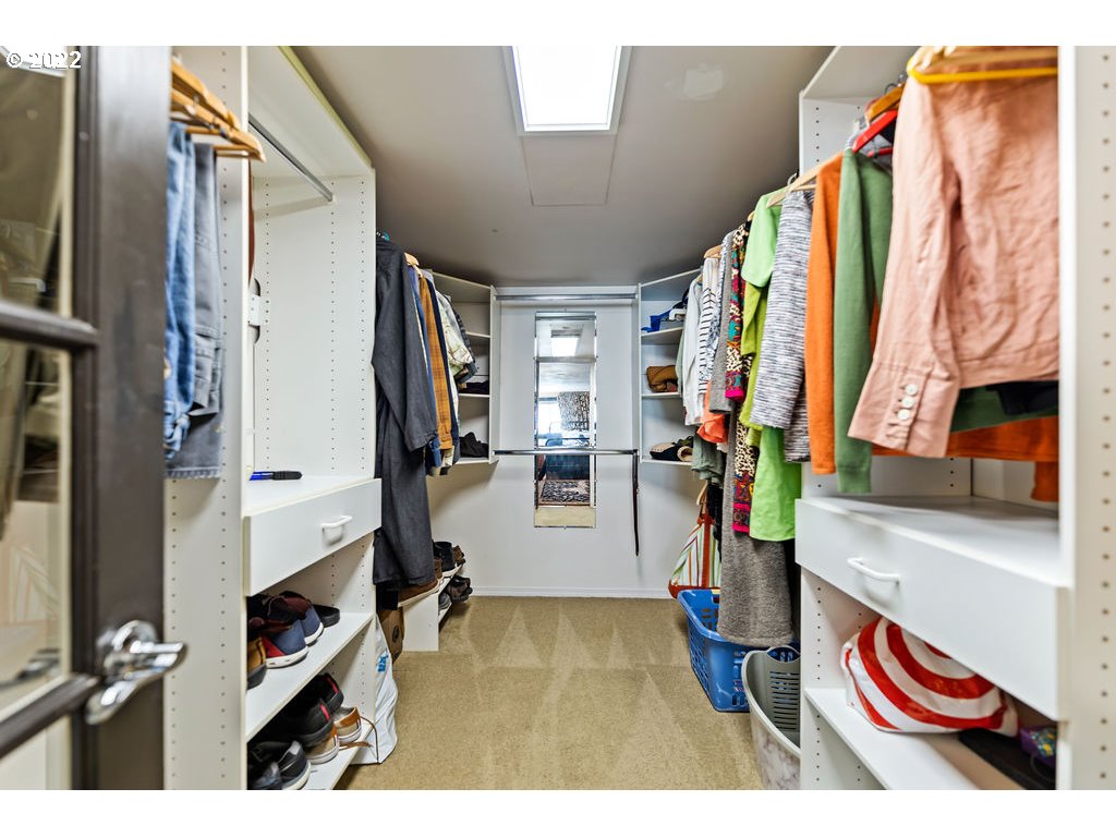 205 North Bridgeton Road, Unit W09 Portland, OR 97217 - Photo 27 of 32 a view of walk in closet with clothes and shoes