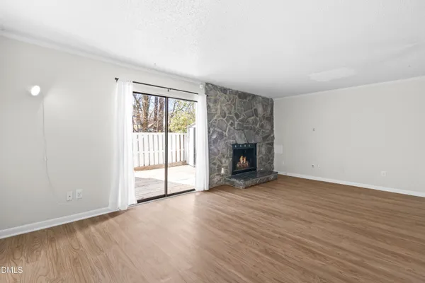 a view of an entryway with wooden floor