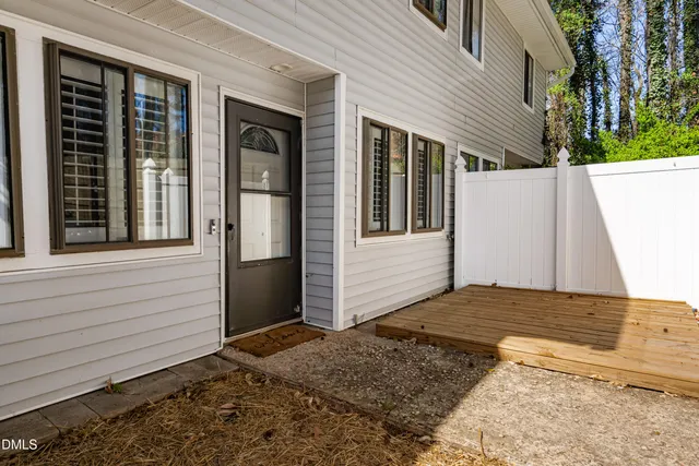 a kitchen with stainless steel appliances granite countertop a stove and white cabinets