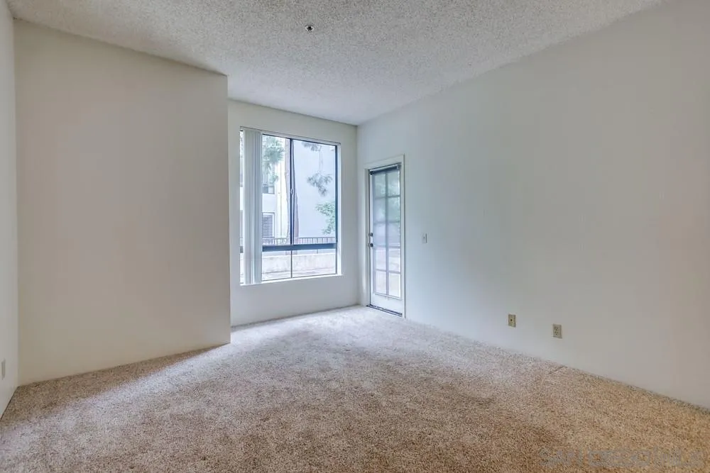 5865 Friars Road, Unit 3113 San Diego, CA 92110 - Photo 12 of 39 an empty room with windows