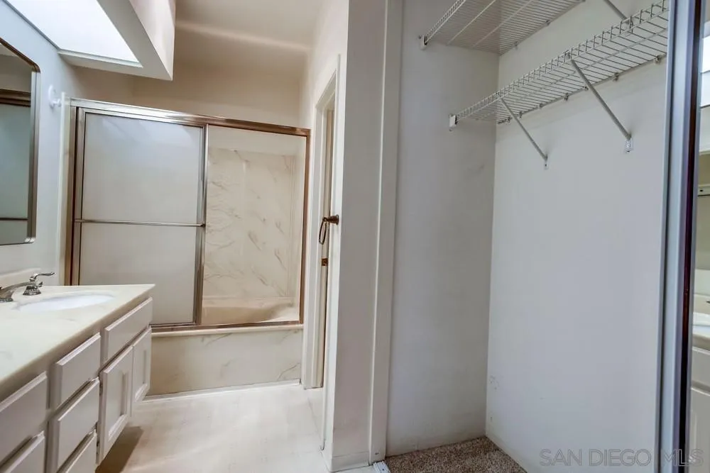 5865 Friars Road, Unit 3113 San Diego, CA 92110 - Photo 16 of 39 a bathroom with a shower and a sink