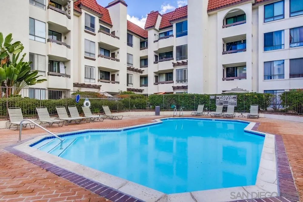 5865 Friars Road, Unit 3113 San Diego, CA 92110 - Photo 28 of 39 a view of building with swimming pool and outdoor seating