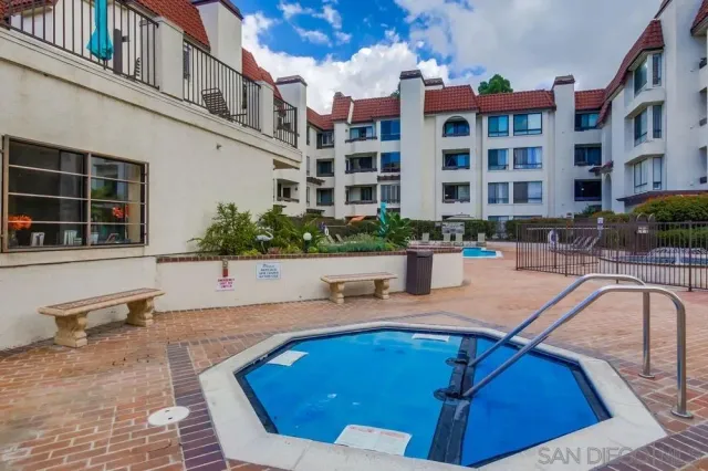 a swimming pool with outdoor seating and yard