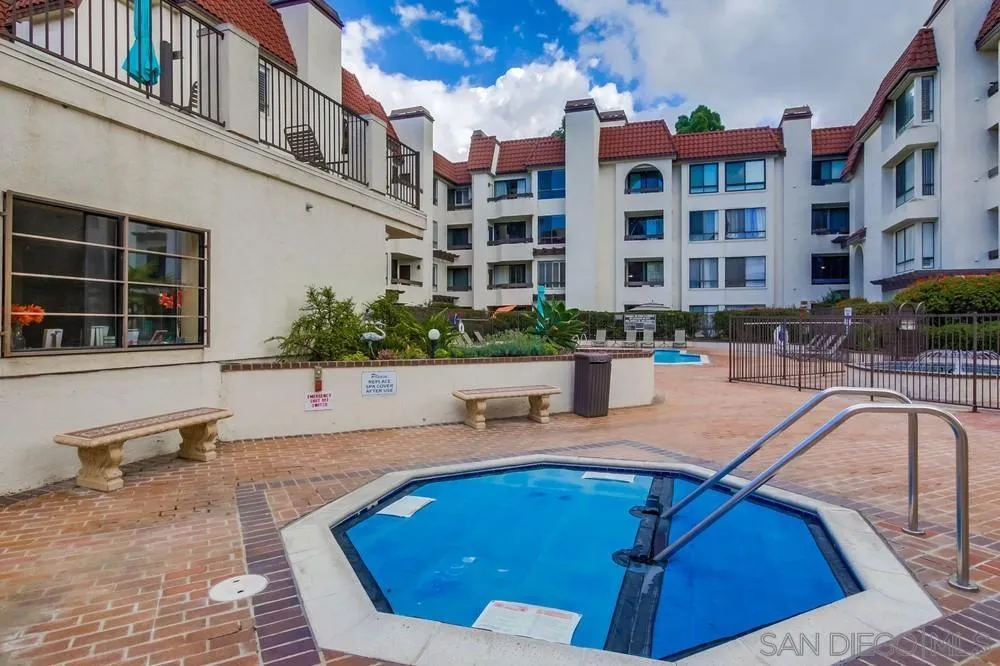 5865 Friars Road, Unit 3113 San Diego, CA 92110 - Photo 30 of 39 a swimming pool with outdoor seating and yard