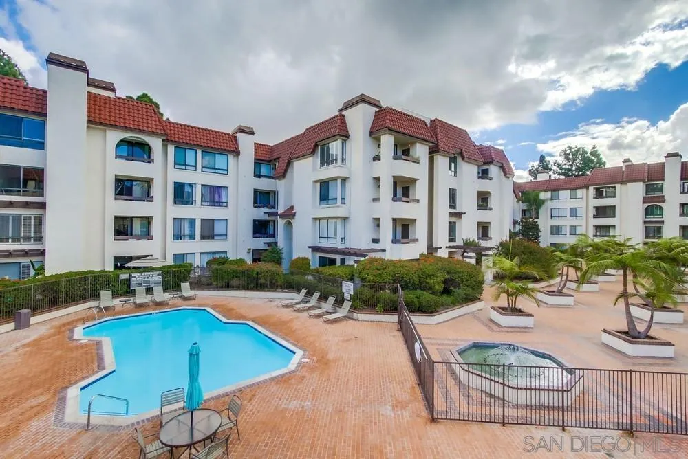 5865 Friars Road, Unit 3113 San Diego, CA 92110 - Photo 31 of 39 a view of a building with swimming pool and sitting area