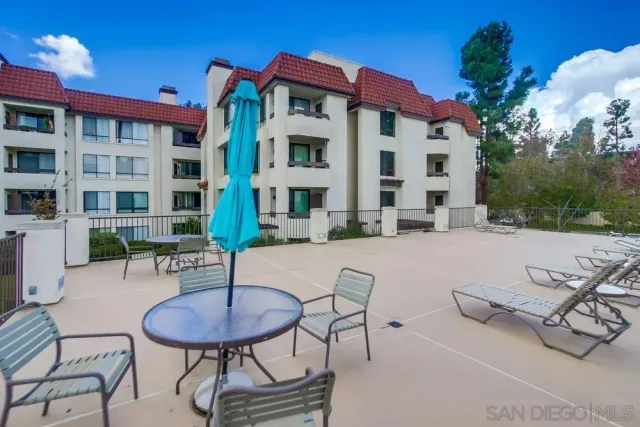 a view of a chairs and table in the patio