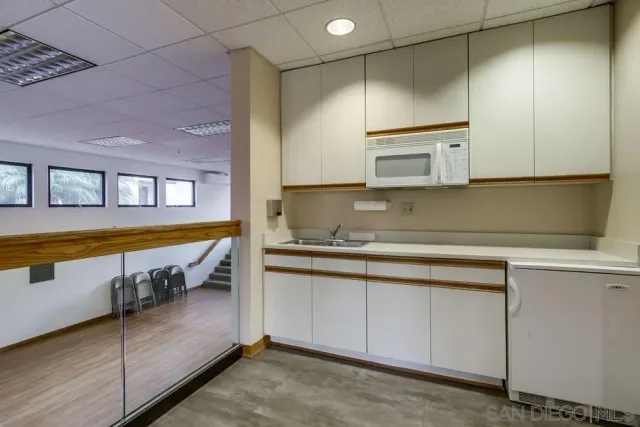 a kitchen with stainless steel appliances granite countertop a sink and a cabinets