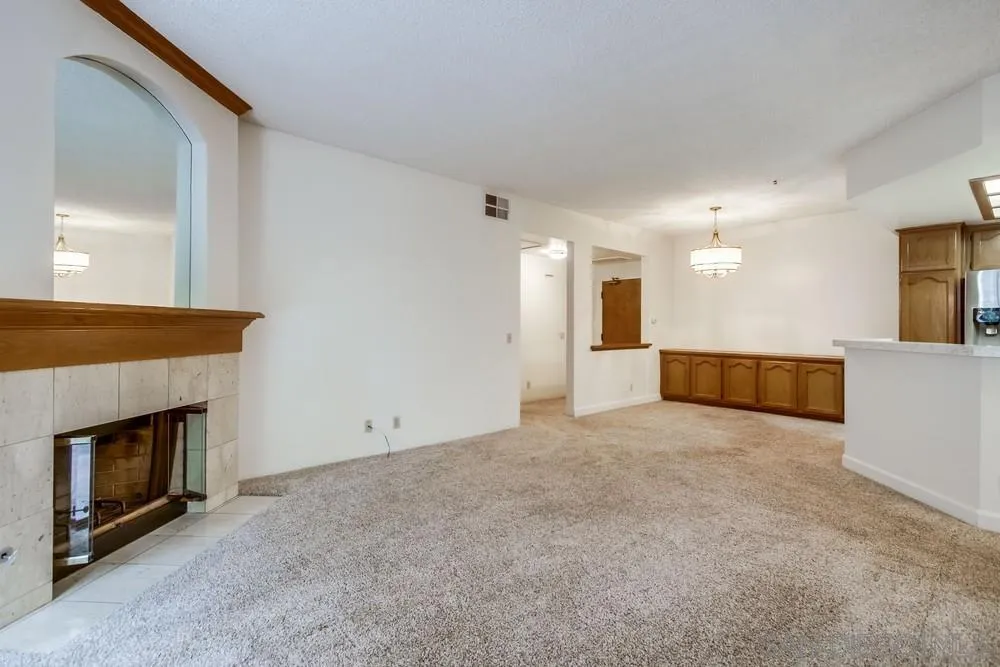 5865 Friars Road, Unit 3113 San Diego, CA 92110 - Photo 5 of 39 a view of a livingroom with a fireplace a sink and a fireplace