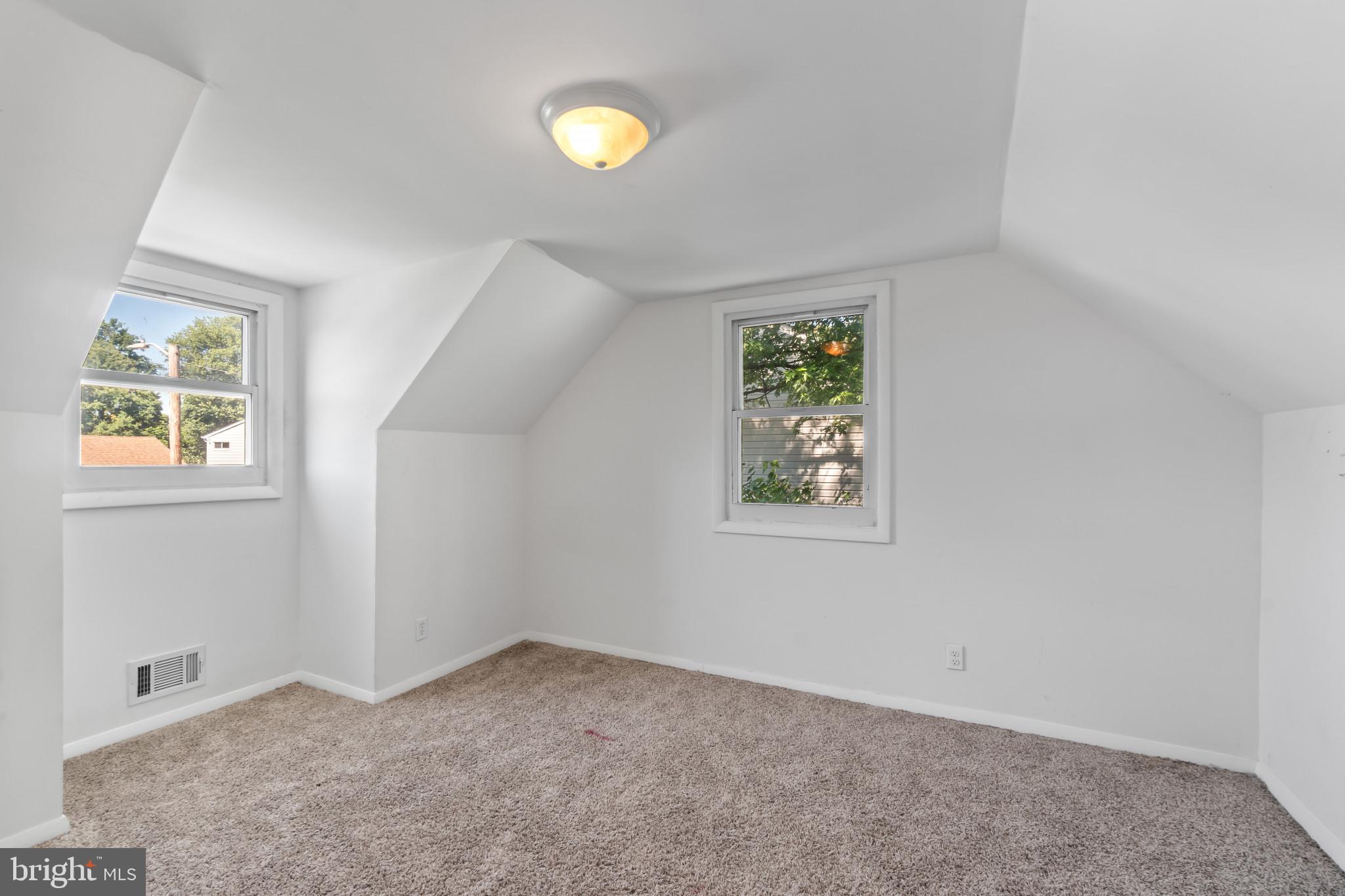 415 Baylor Road Glen Burnie, MD 21061 - Photo 17 of 29 an empty room with windows and closet