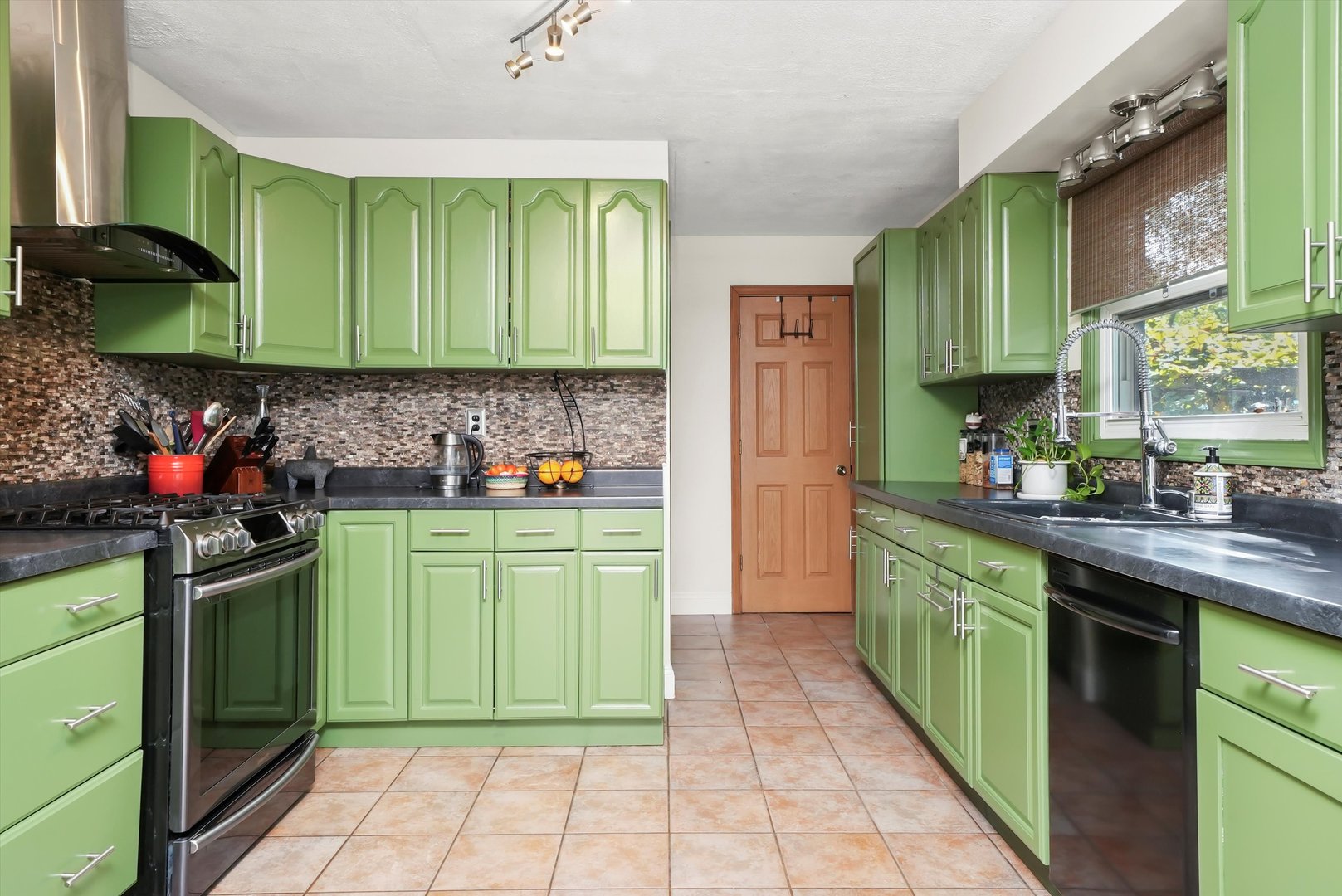 836 Bonita Avenue Elk Grove Village, IL 60007 - Photo 17 of 41 a kitchen with a sink cabinets and a stove top oven