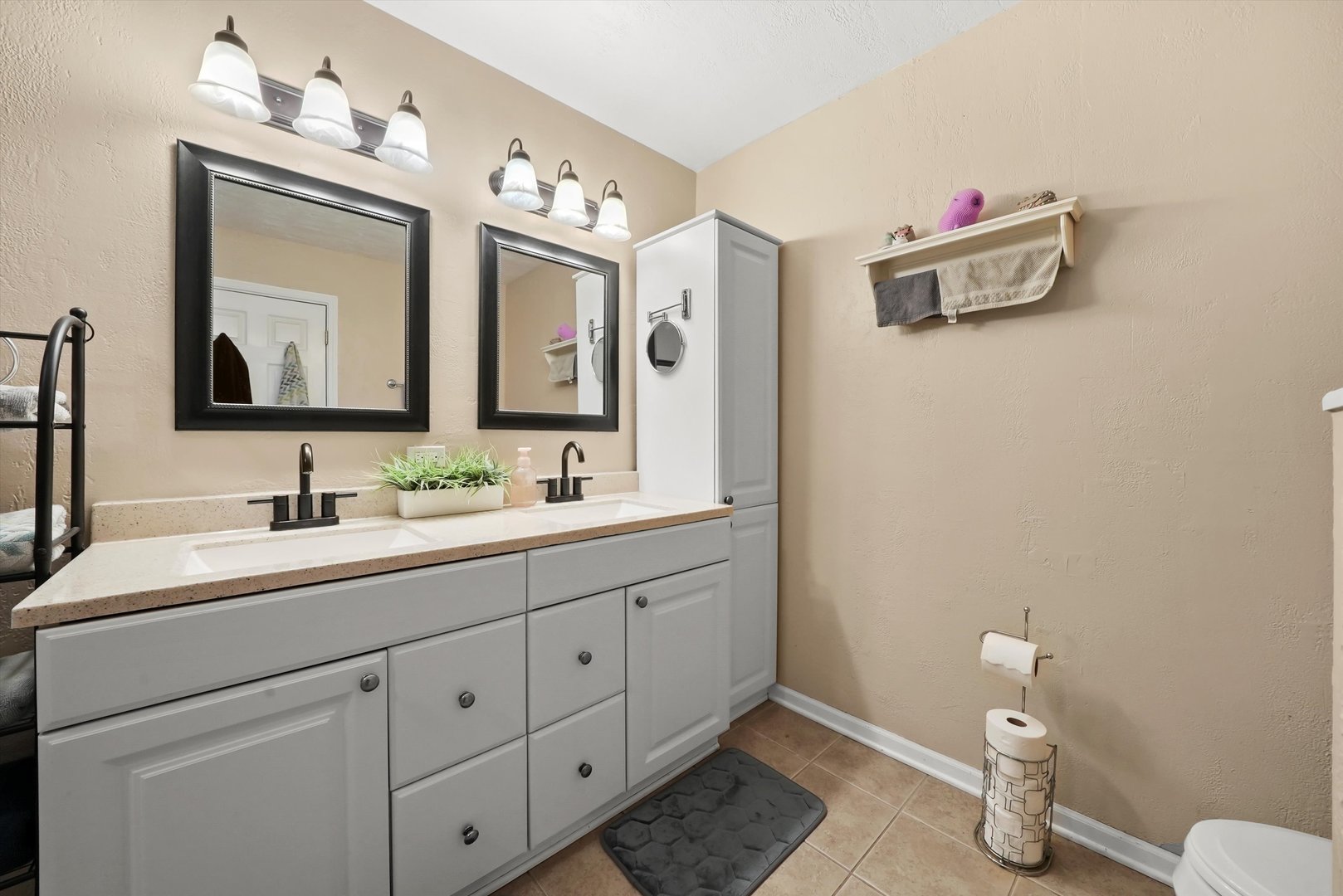 836 Bonita Avenue Elk Grove Village, IL 60007 - Photo 28 of 41 a bathroom with a double vanity sink mirror and toilet