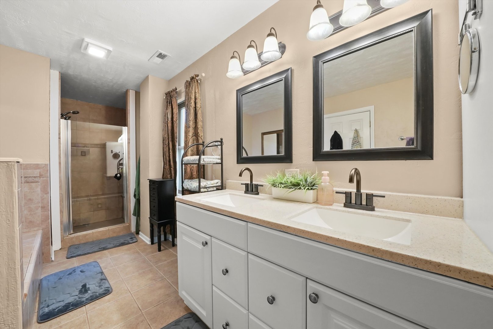 836 Bonita Avenue Elk Grove Village, IL 60007 - Photo 29 of 41 a bathroom with a double vanity sink mirror and shower