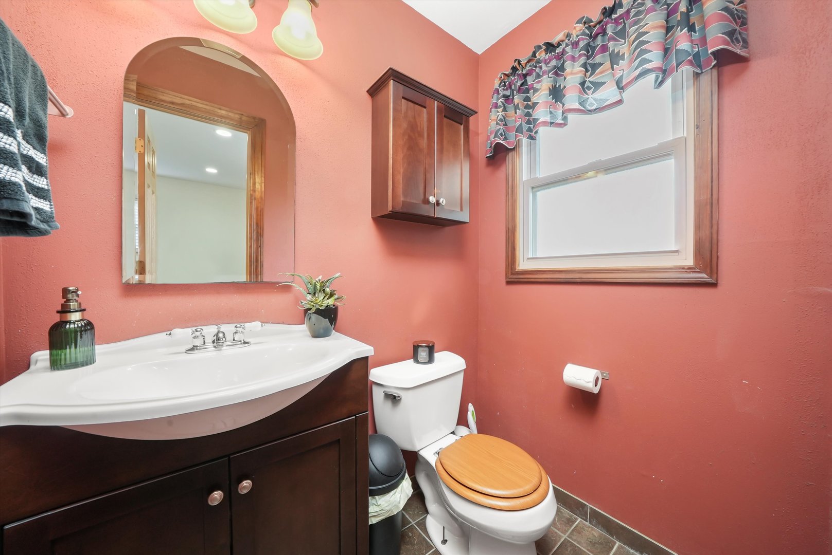 836 Bonita Avenue Elk Grove Village, IL 60007 - Photo 10 of 41 a bathroom with a sink a mirror and a toilet