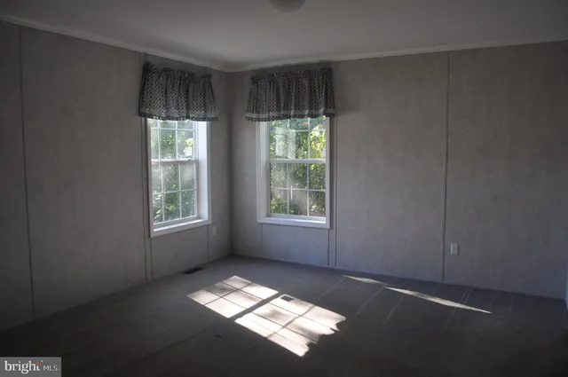 a view of an empty room and window