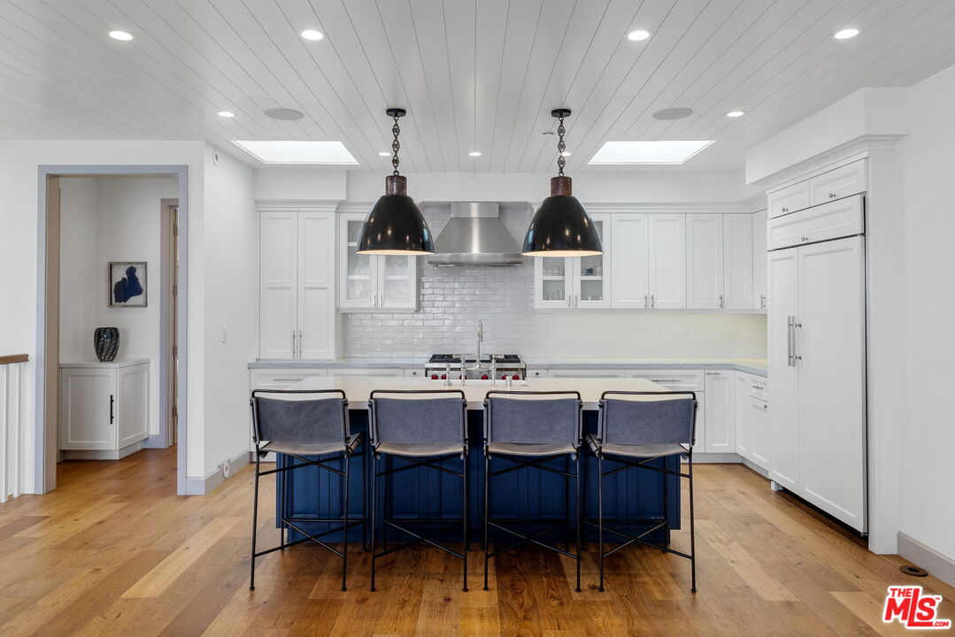 703 Bayview Drive Manhattan Beach, CA 90266 - Photo 11 of 36 a view of a dining room with furniture and wooden floor