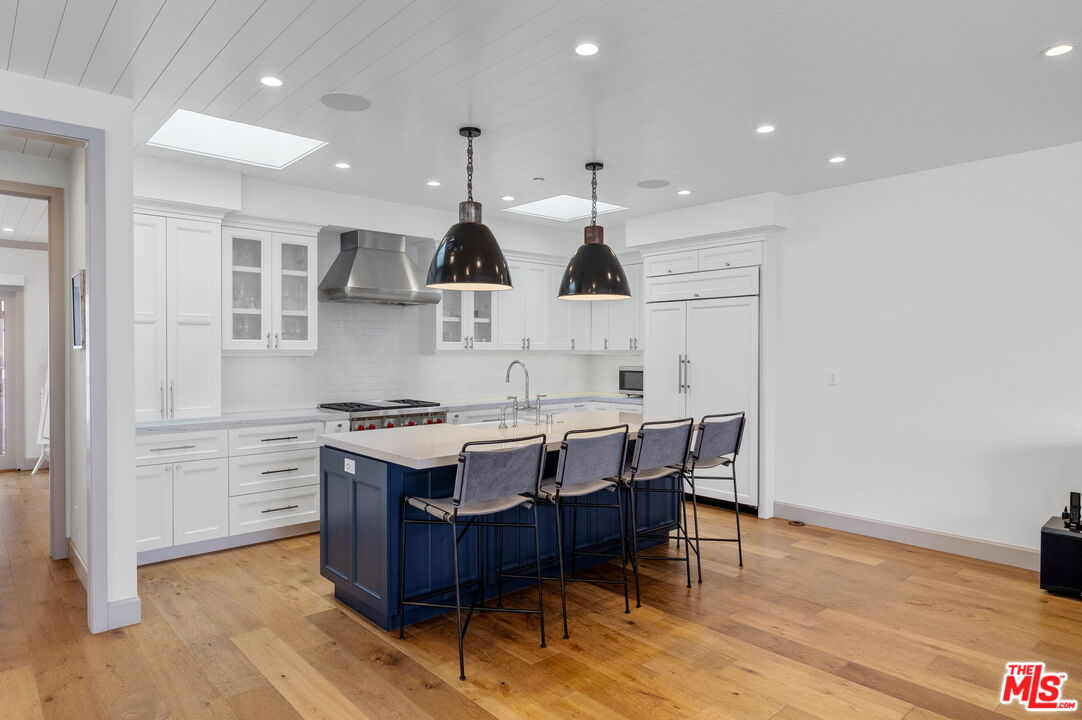 703 Bayview Drive Manhattan Beach, CA 90266 - Photo 13 of 36 a kitchen with a stove a sink and a refrigerator