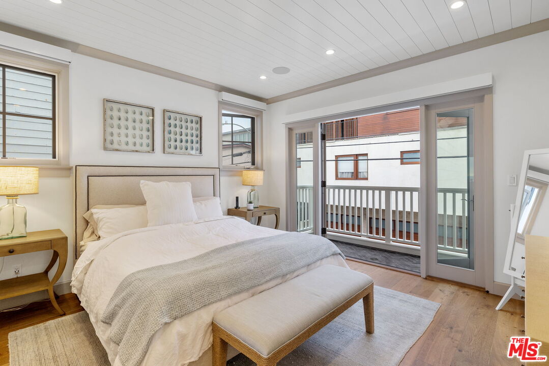 703 Bayview Drive Manhattan Beach, CA 90266 - Photo 16 of 36 a spacious bedroom with a bed and a window