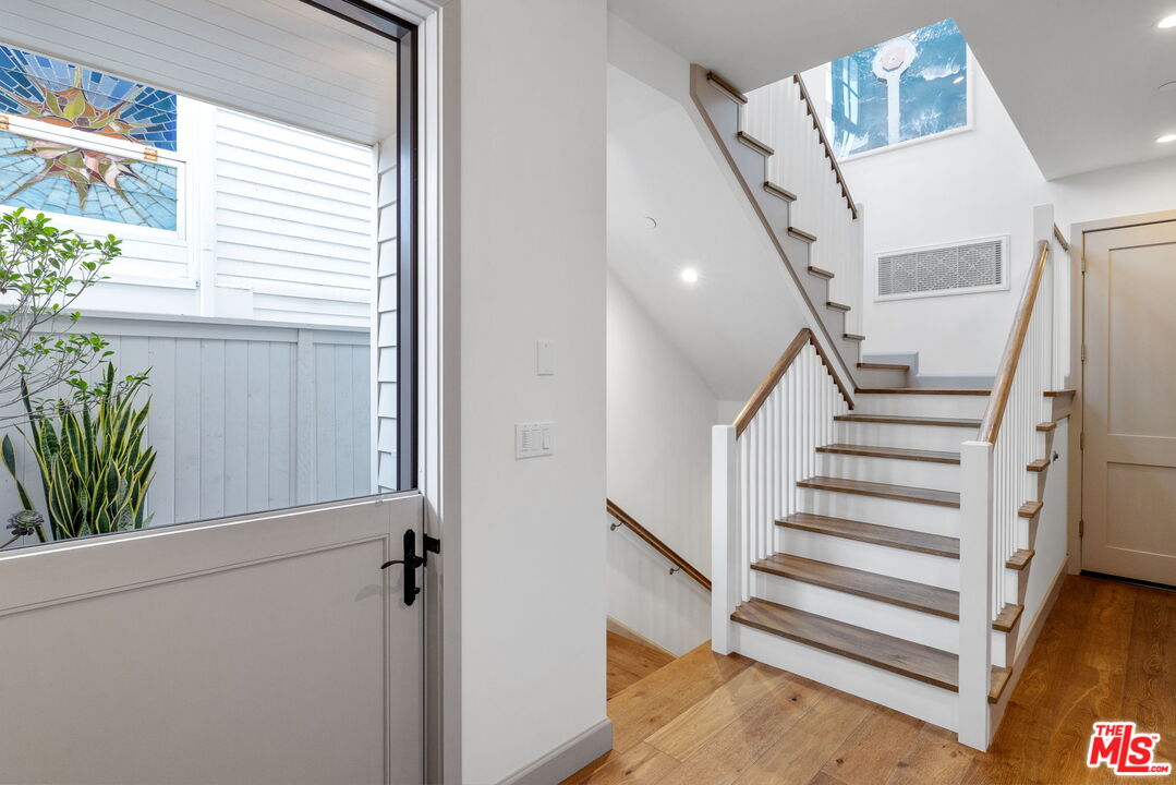 703 Bayview Drive Manhattan Beach, CA 90266 - Photo 20 of 36 a view of entryway with stairs and wooden floor