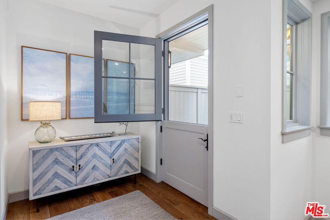 703 Bayview Drive Manhattan Beach, CA 90266 - Photo 21 of 36 a bedroom with a bed and a window