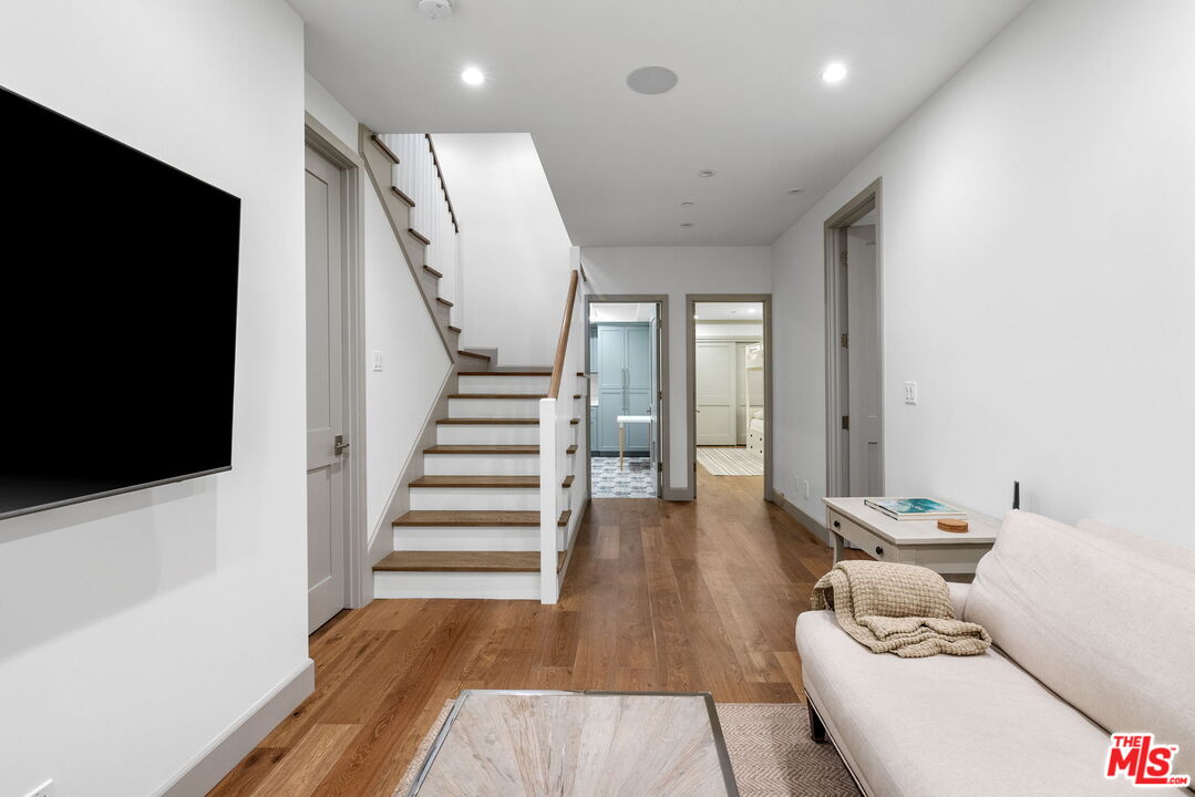 703 Bayview Drive Manhattan Beach, CA 90266 - Photo 25 of 36 a living room with furniture and a flat screen tv