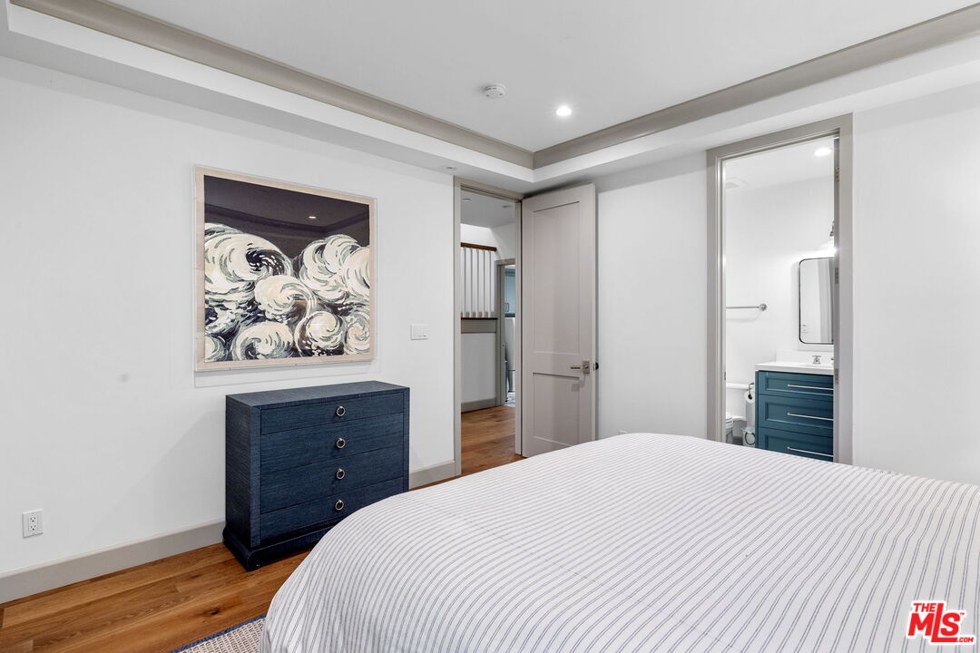 703 Bayview Drive Manhattan Beach, CA 90266 - Photo 28 of 36 a bedroom with a bed and a dresser