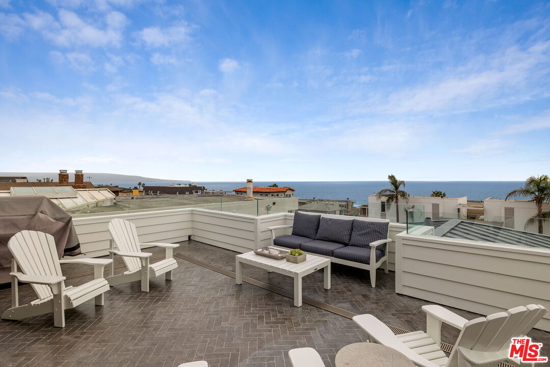 703 Bayview Drive Manhattan Beach, CA 90266 - Photo 4 of 36 a terrace with outdoor seating and city view