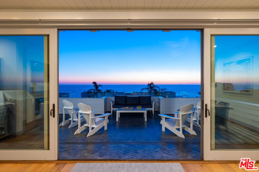 703 Bayview Drive Manhattan Beach, CA 90266 - Photo 6 of 36 a living room with furniture a rug and a fireplace