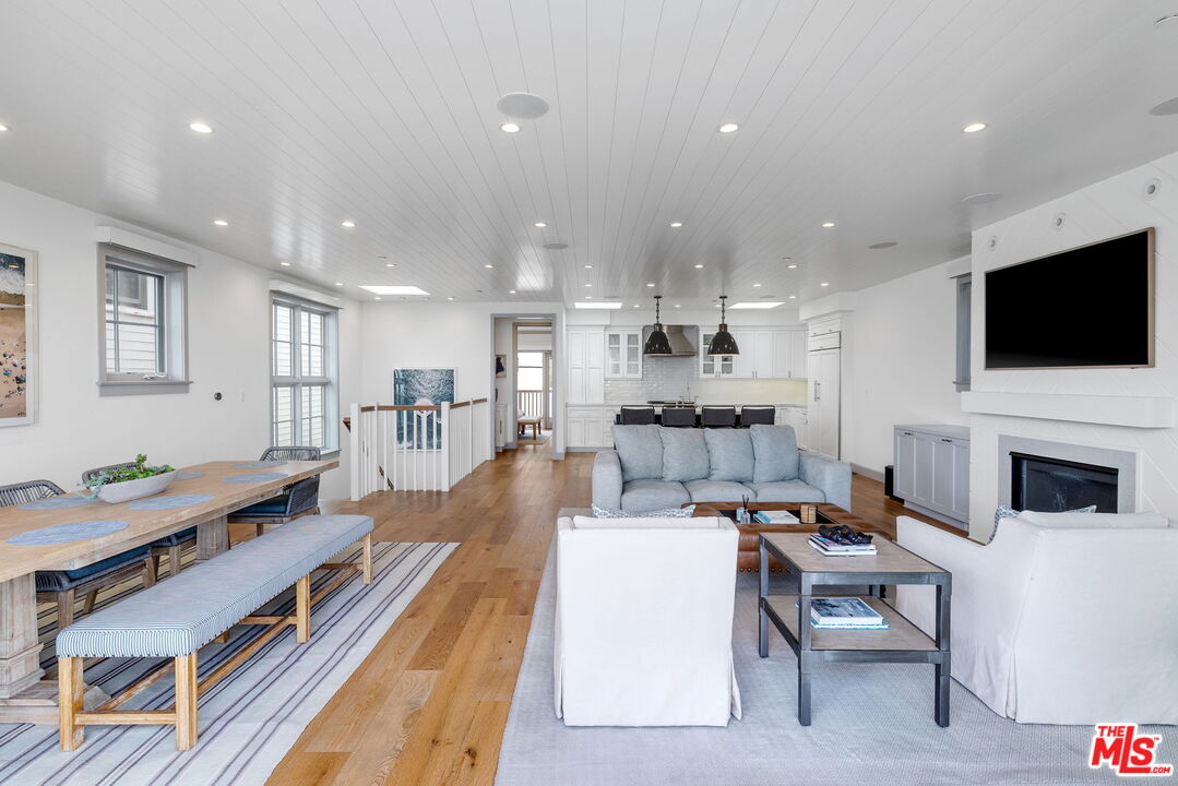 703 Bayview Drive Manhattan Beach, CA 90266 - Photo 9 of 36 a living room with fireplace furniture and a flat screen tv
