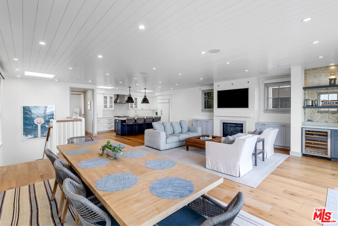 703 Bayview Drive Manhattan Beach, CA 90266 - Photo 10 of 36 a living room with fireplace furniture and a flat screen tv