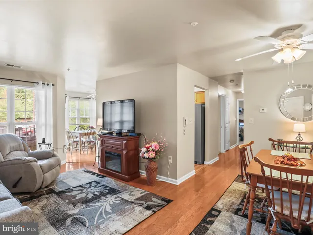 a living room with furniture fireplace and flat screen tv