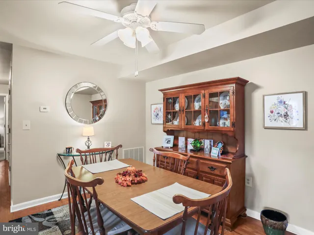 a view of a dining room with furniture and a chandelier
