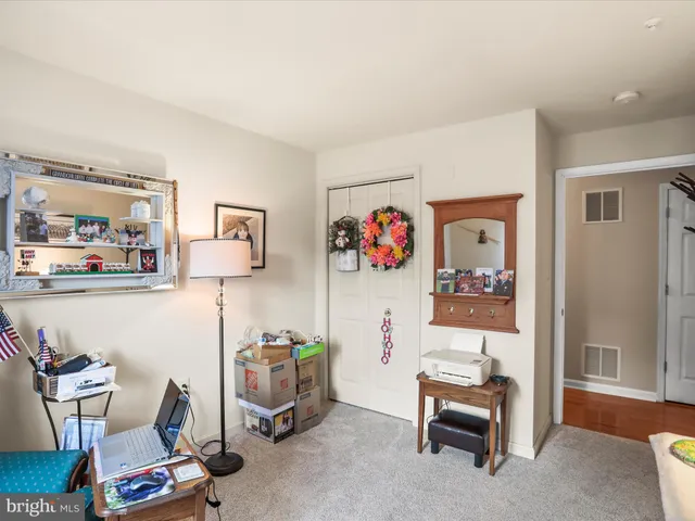 a room with furniture and white walls
