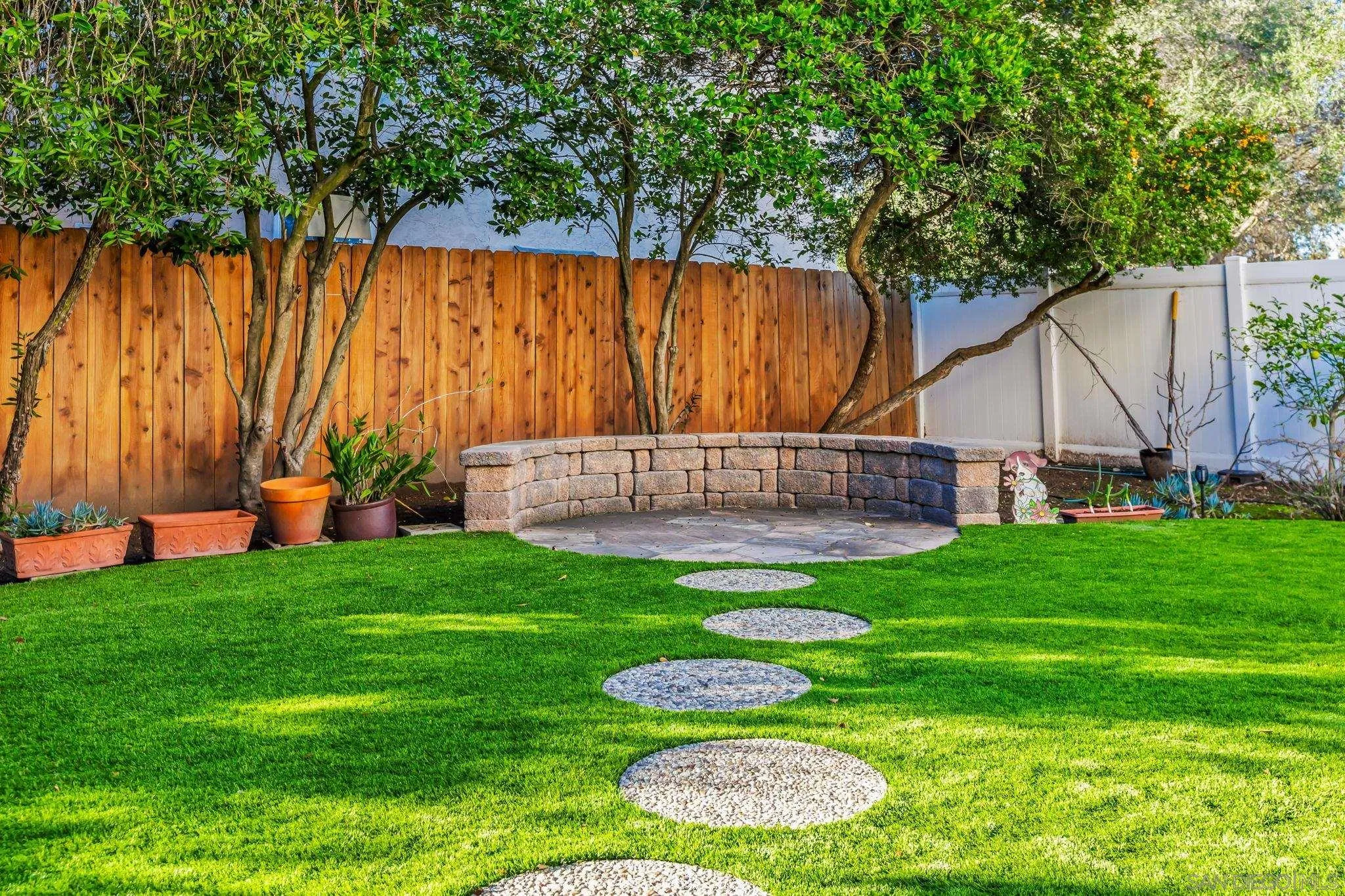 10831 Ironwood Road Scripps Ranch, CA 92131 - Photo 23 of 25 a view of a backyard with a garden and entertaining space