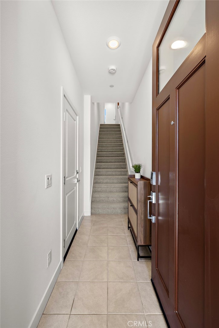 61 Wheelbarrow Road Rancho Mission Viejo, CA 92694 - Photo 25 of 74 a hallway with stairs