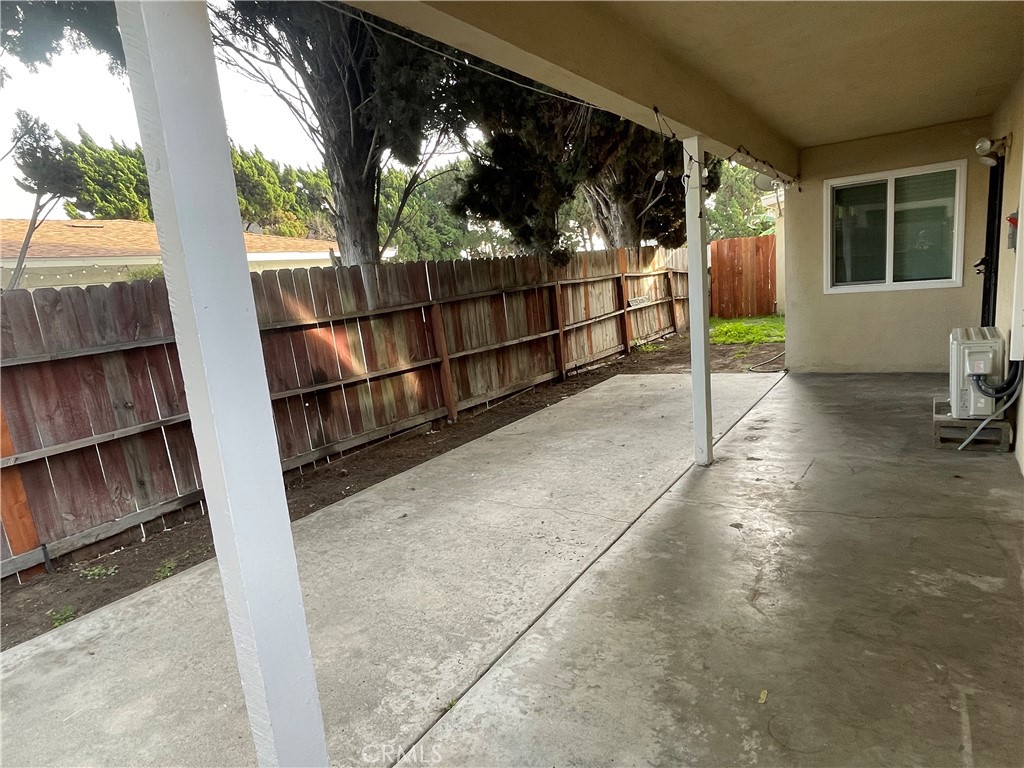 17226 Virginia Avenue, Unit D Bellflower, CA 90706 - Photo 8 of 8 a view of balcony with wooden floor and outdoor seating