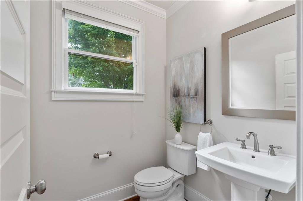211 West Hill Street Decatur, GA 30030 - Photo 20 of 43 a bathroom with a sink toilet and a mirror