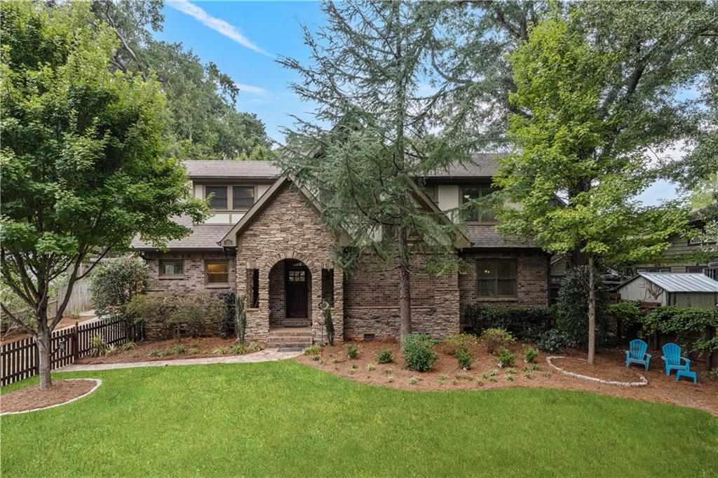 211 West Hill Street Decatur, GA 30030 - Photo 2 of 43 a front view of a house with a garden and yard