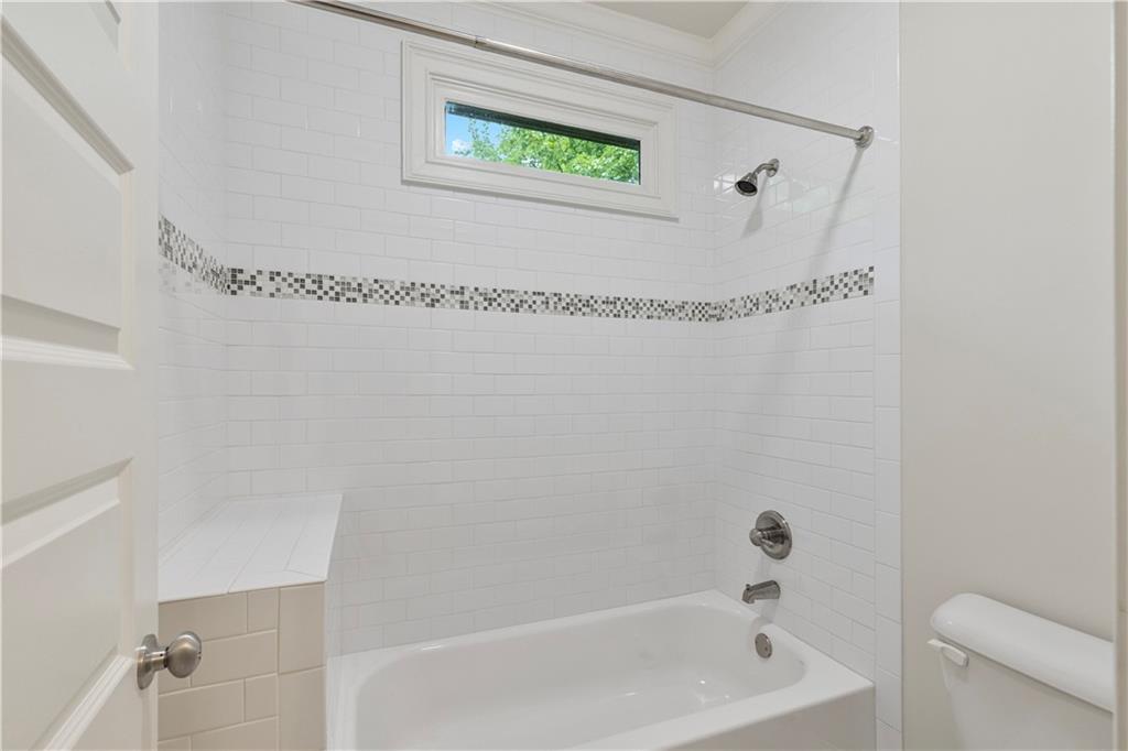 211 West Hill Street Decatur, GA 30030 - Photo 28 of 43 a bathroom with a bath tub and a shower