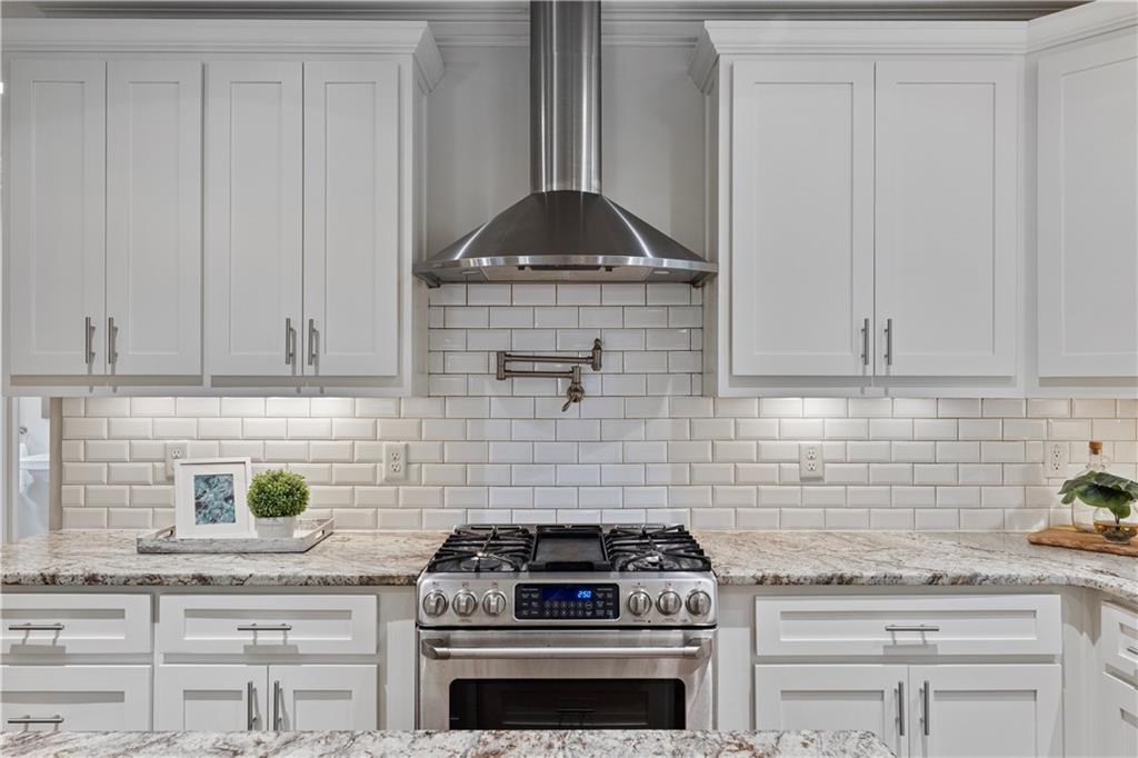 211 West Hill Street Decatur, GA 30030 - Photo 10 of 43 a stove top oven sitting inside of a kitchen