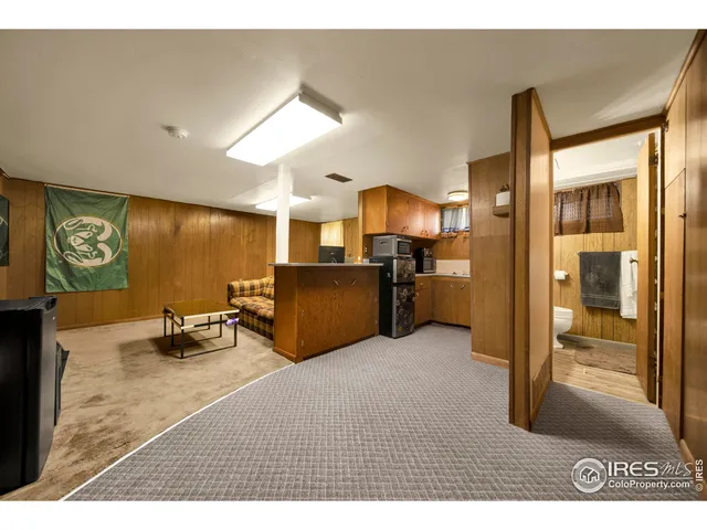 a view of a livingroom with furniture and a flat screen tv