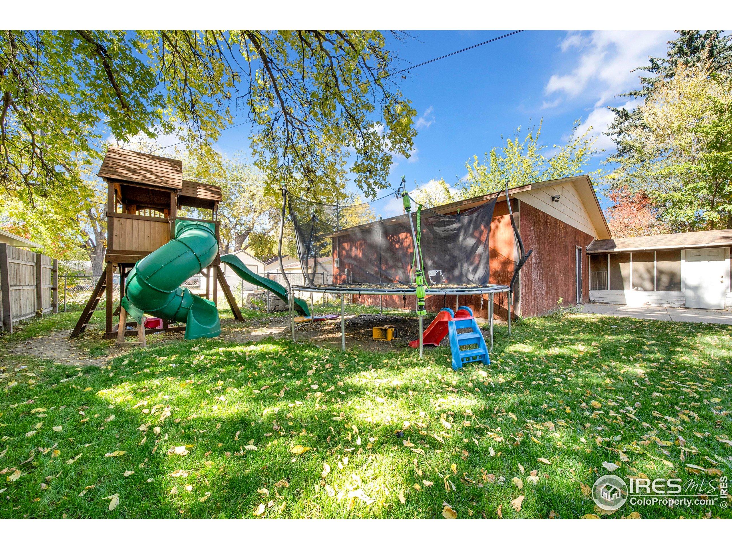724 Carson Street Brush, CO 80723 - Photo 27 of 29 a view of playground with a slide and swing