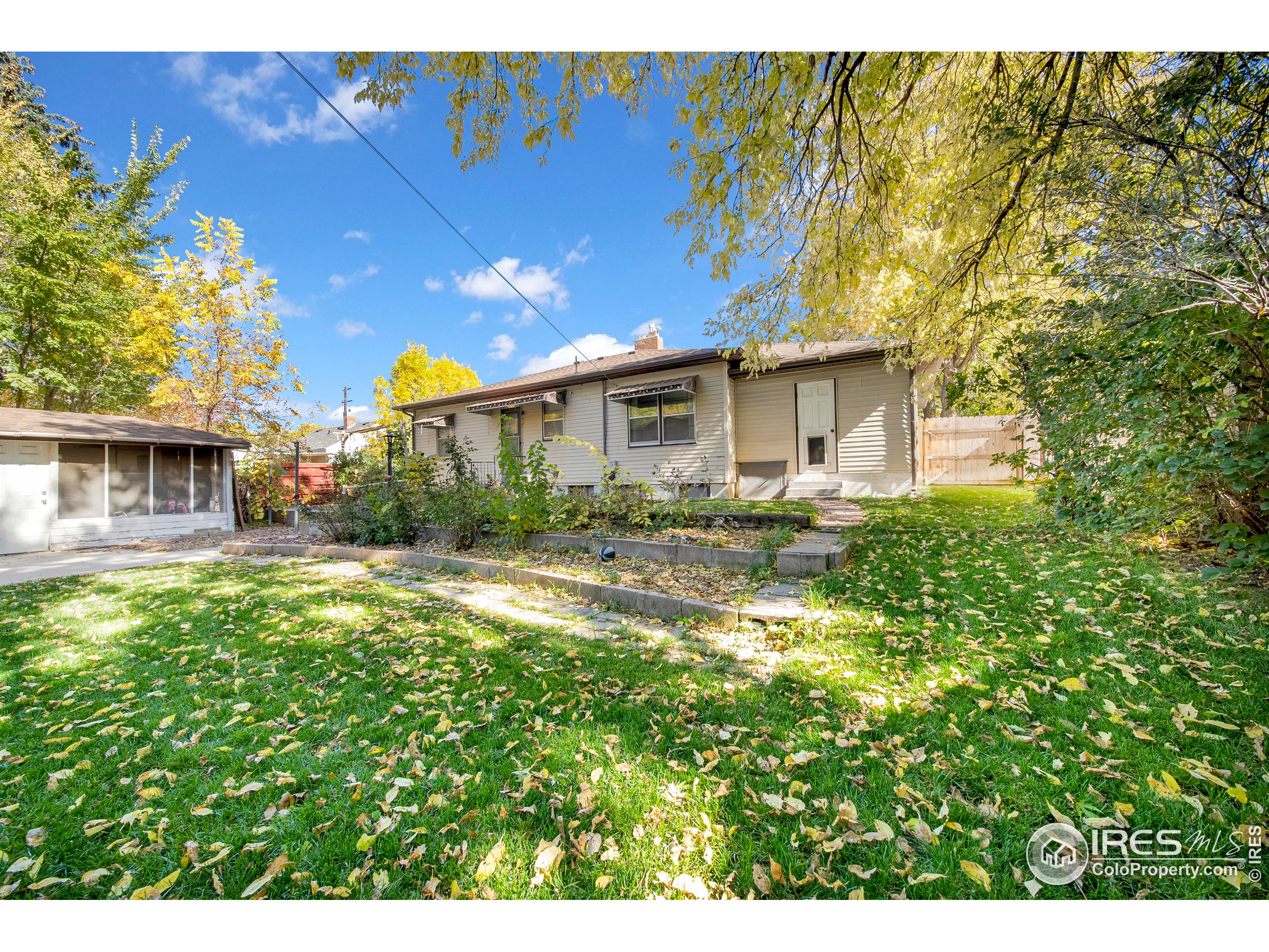 724 Carson Street Brush, CO 80723 - Photo 28 of 29 a view of a house with a yard