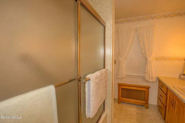 a bathroom with a tub and a sink