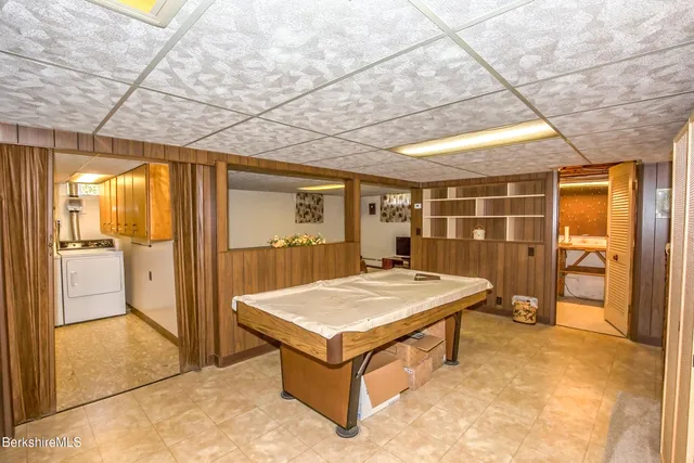 a room with pool table and glass door