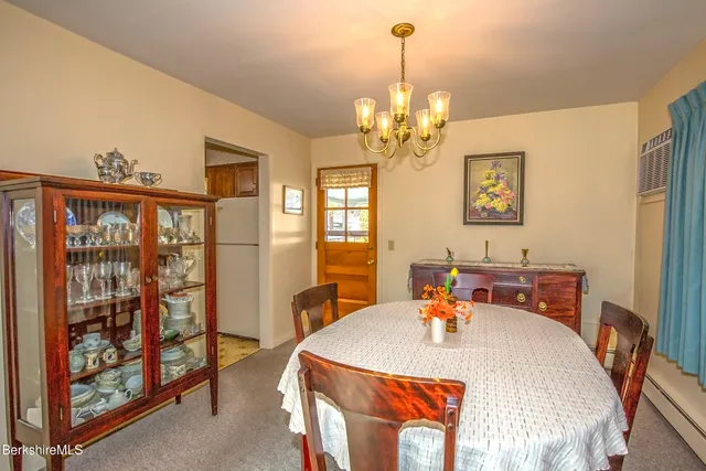 a bed room with a bed and a chandelier