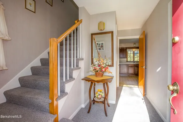 a front view of a house with outdoor seating