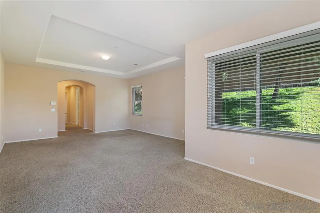 1757 Monte Mar Road Vista, CA 92084 - Photo 12 of 25 a view of a livingroom with an empty space and a window
