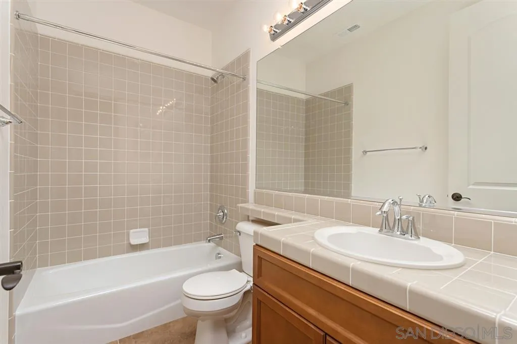 1757 Monte Mar Road Vista, CA 92084 - Photo 20 of 25 a bathroom with a sink a toilet and shower